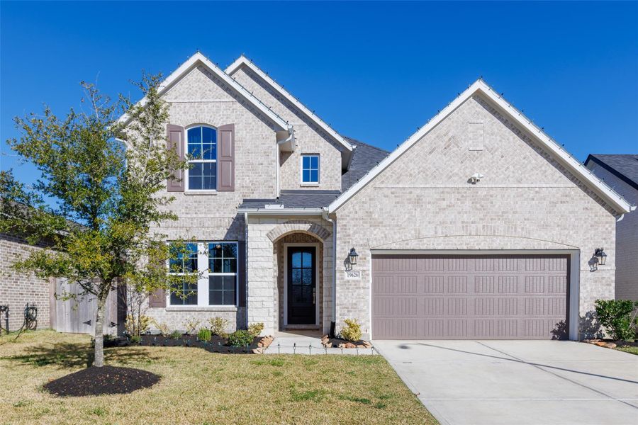Front exterior of a new home in Amira: Heritage Collection, Tomball, TX, highlighting curb appeal (Image 21).