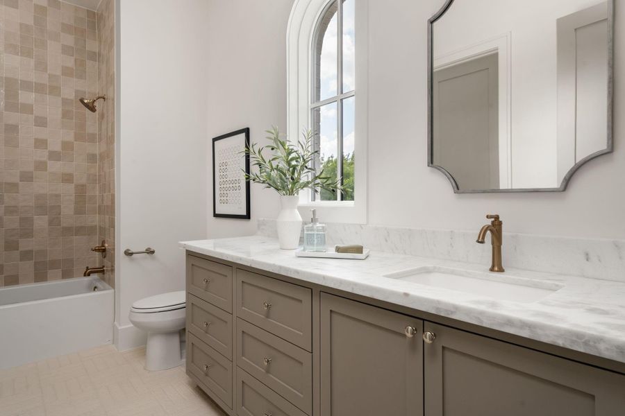 Secondary bathrooms are sizable with each having a unique design scheme.