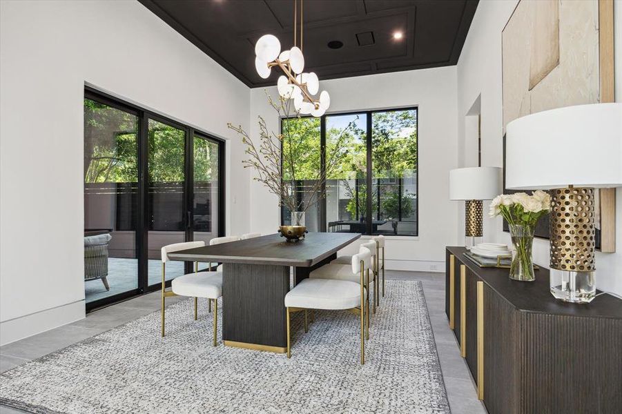 Formal Dining Room off of the main entry across from the wet bar and wine cellar and views of the interior courtyard and side Yard