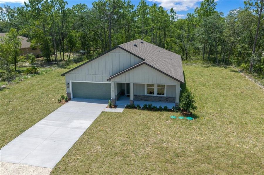 Front exterior of a new home in , Weeki Wachee, FL, highlighting curb appeal (Image 33). Front exterior of a new home in , Weeki Wachee, FL, highlighting curb appeal (Image 33).