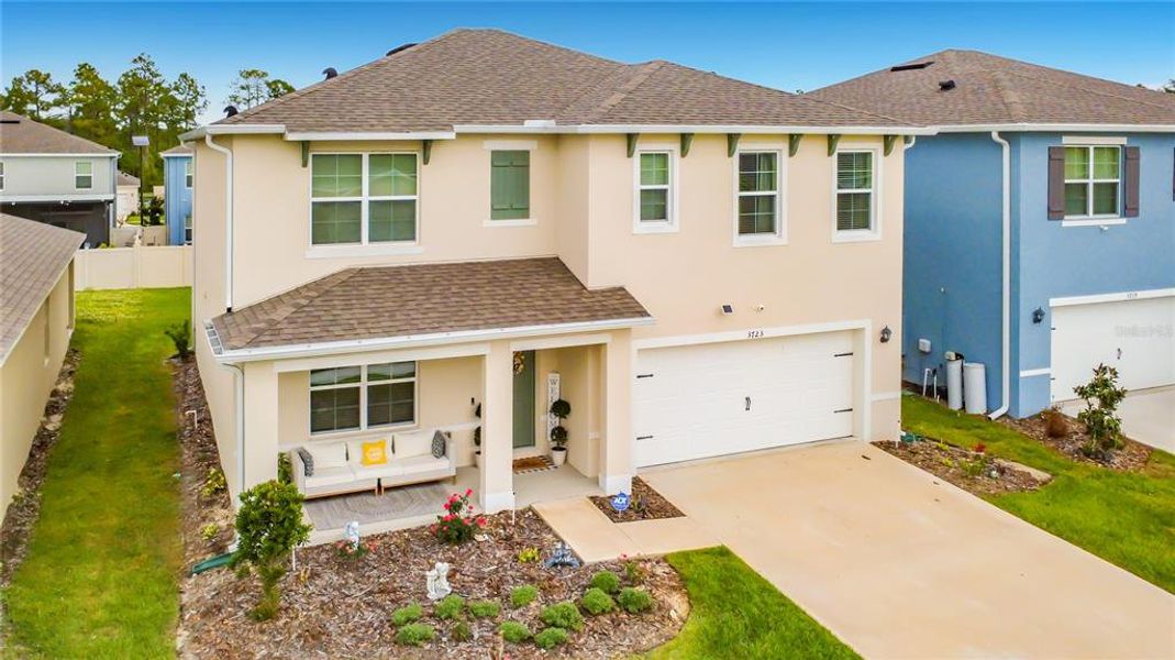 Front exterior of a new home in Edgemont at Serenoa, Clermont, FL, highlighting curb appeal (Image 24).