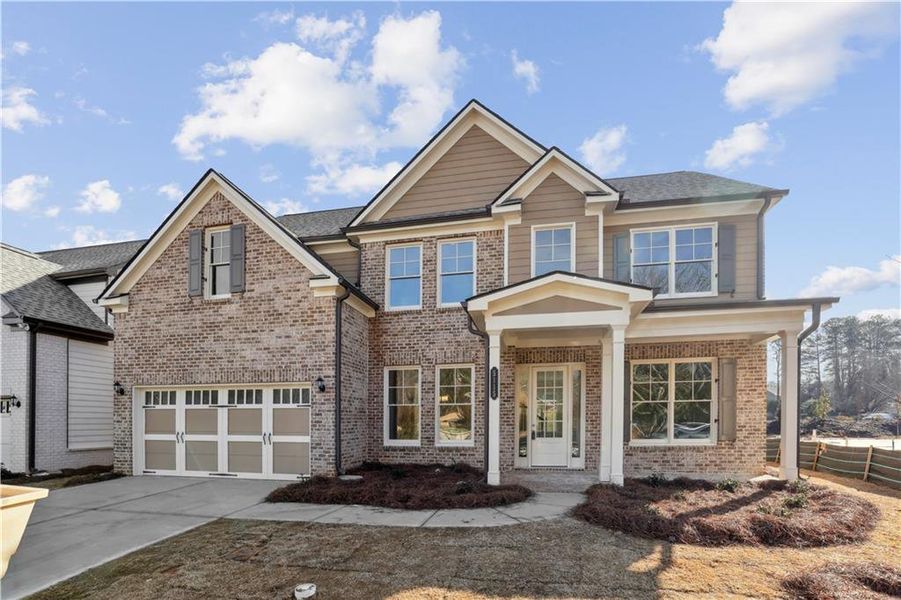 Front exterior of a new home in , Sugar Hill, GA, highlighting curb appeal (Image 1).