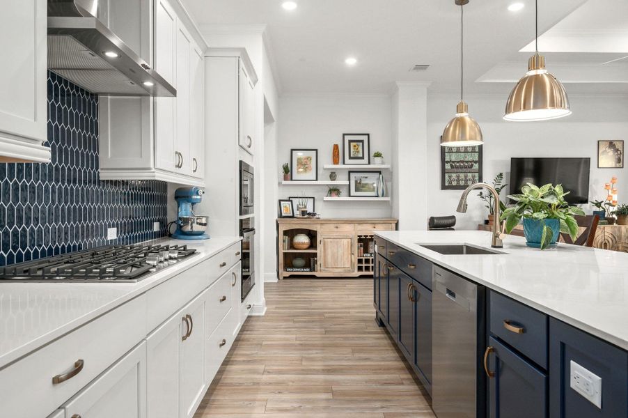 You’ll love the gourmet kitchen and spacious island with quartz counters, pendant lighting, stainless steel appliances, abundant storage, built-ins, and tasteful finishes You’ll love the gourmet kitchen and spacious island with quartz counters, pendant lighting, stainless steel appliances, abundant storage, built-ins, and tasteful finishes