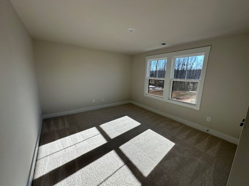 This airy room features ample natural light and pl