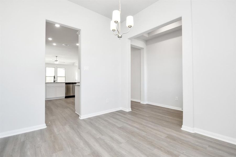 View from dining are to the kitchen and foyer.