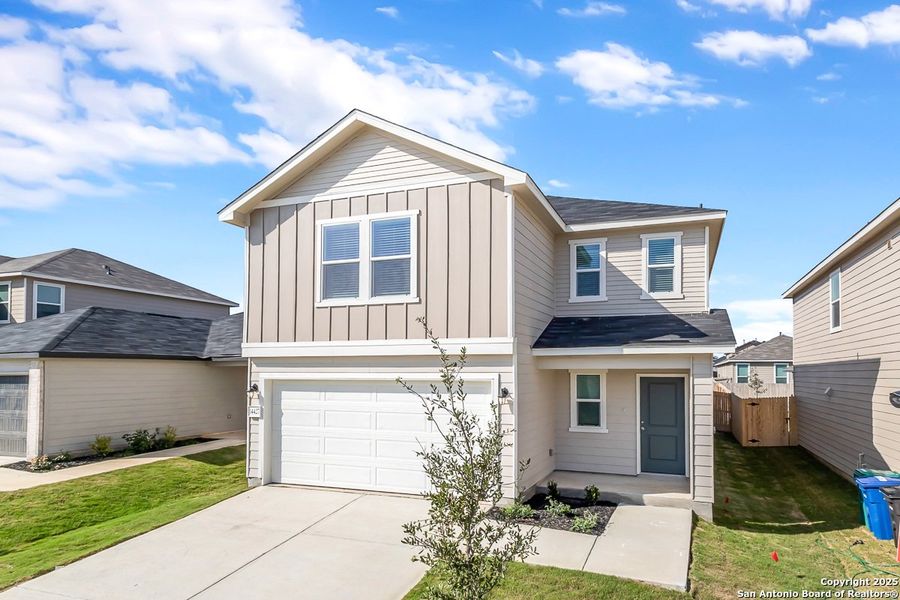 Front exterior of a new home in Southton Cove, Elmendorf, TX, highlighting curb appeal (Image 1). Front exterior of a new home in Southton Cove, Elmendorf, TX, highlighting curb appeal (Image 1).