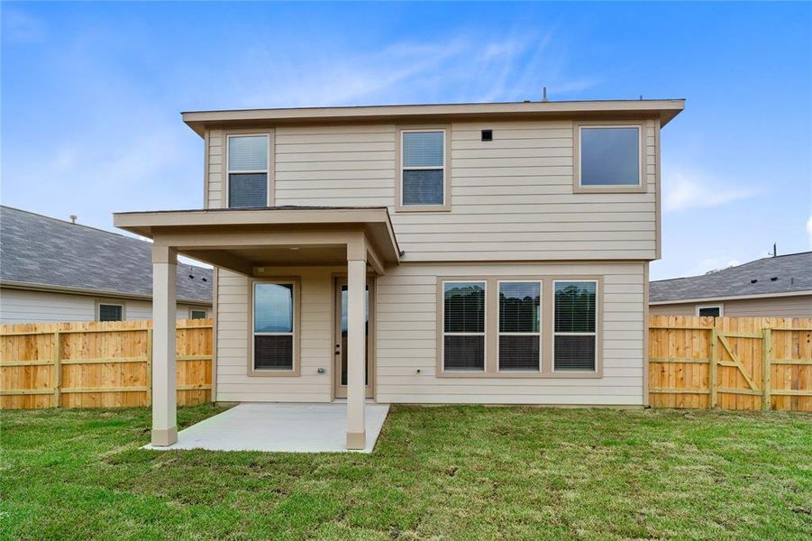 Come and see this spacious backyard with its covered patio. There is plenty of room for the kids to play and adults to relax!