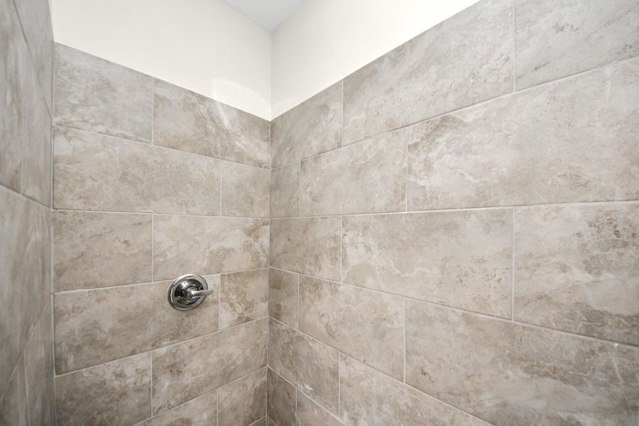 A closer look at the luxurious mud-set shower, complete with a rainfall showerhead—combining elegance and a spa-like experience in the primary bathroom - (representation photo).