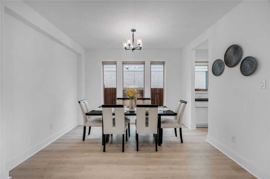 Tasteful dining space offers ample natural illumination and a refined, airy atmosphere.