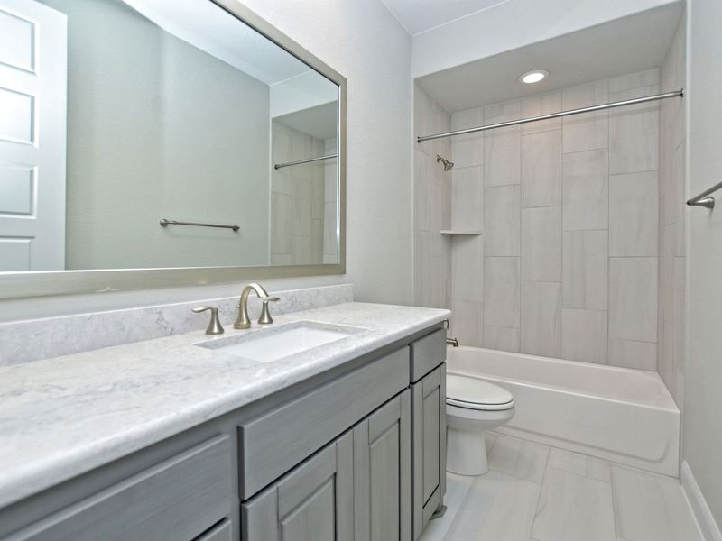 Representative furnished interior of a home built from the Madera II by Giddens Homes in Scofield Farms Estates, Georgetown (Image 187).