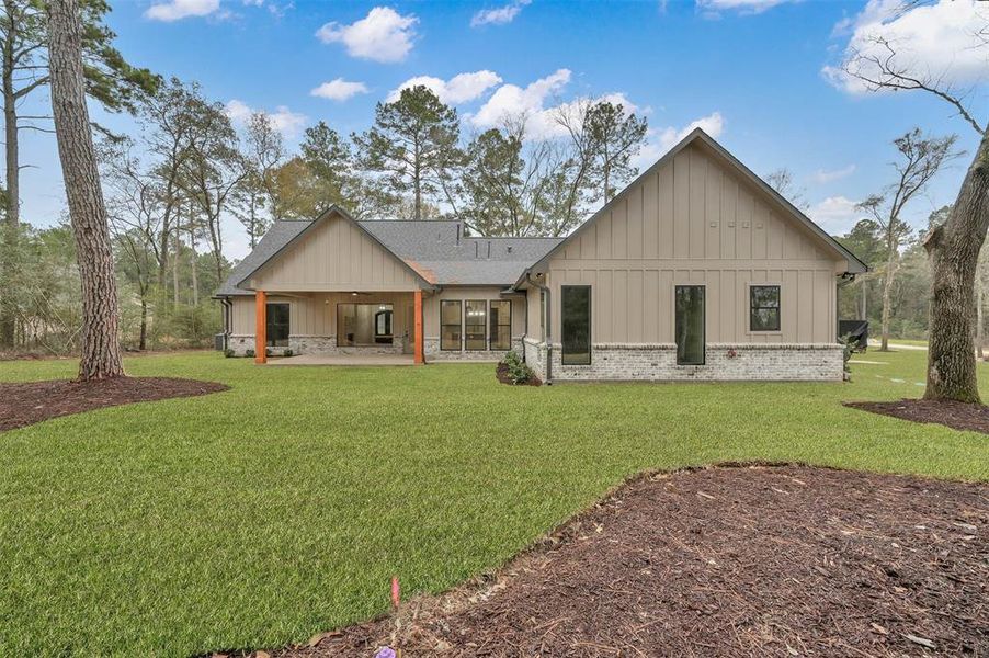 A view of your spacious backyard with still plenty of trees to give you privacy.