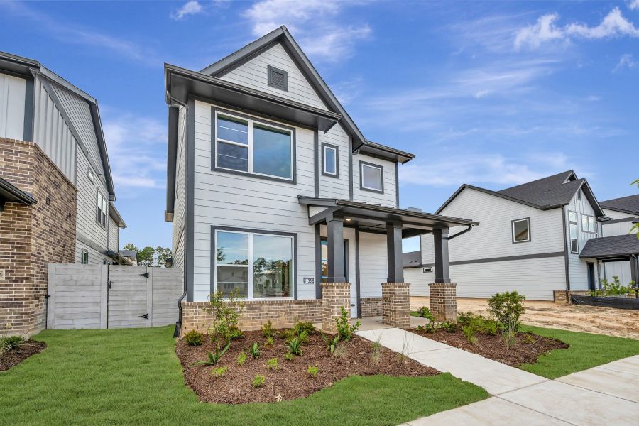 Front exterior of a new home in Two Step Farm - Cottages Row Collection, Montgomery, TX, highlighting curb appeal (Image 19). Front exterior of a new home in Two Step Farm - Cottages Row Collection, Montgomery, TX, highlighting curb appeal (Image 19).