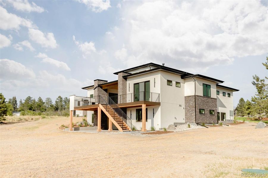 Front exterior of a new home in , Franktown, CO, highlighting curb appeal (Image 1).