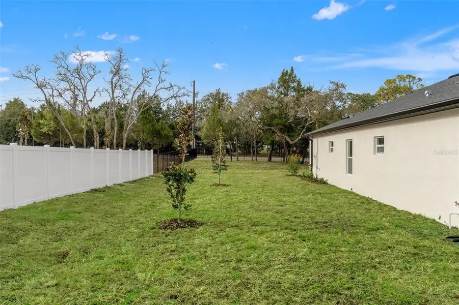 Exterior details and patio area of a home in , Spring Hill (Image 4). Exterior details and patio area of a home in , Spring Hill (Image 4).
