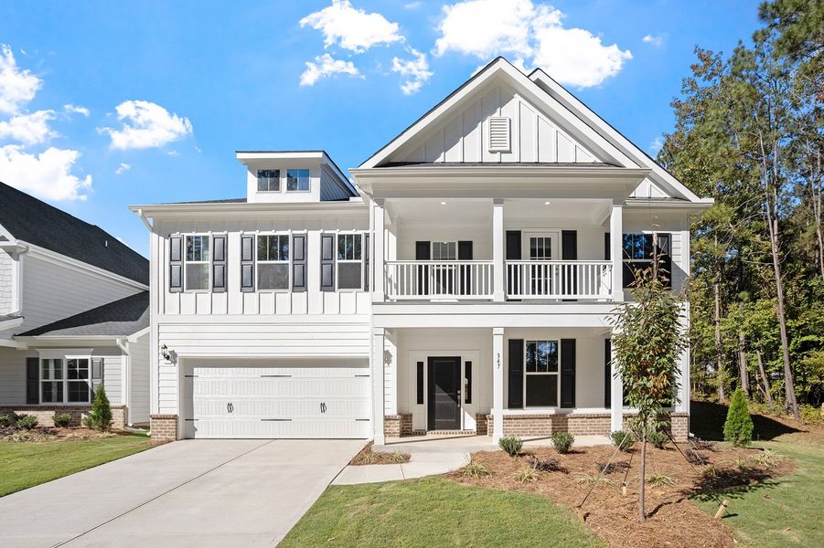 Front exterior of a new home in Georgias Landing, Raleigh, NC, highlighting curb appeal (Image 1).