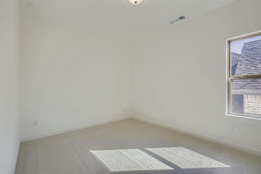 Empty room with light colored carpet Empty room with light colored carpet