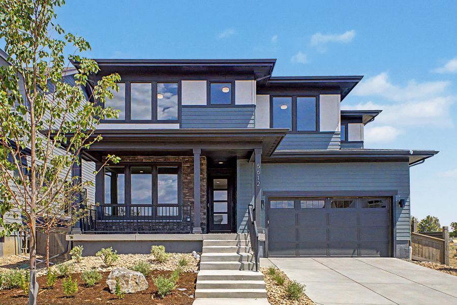 Front exterior of a new home in West Grange, Longmont, CO, highlighting curb appeal (Image 2). Front exterior of a new home in West Grange, Longmont, CO, highlighting curb appeal (Image 2).
