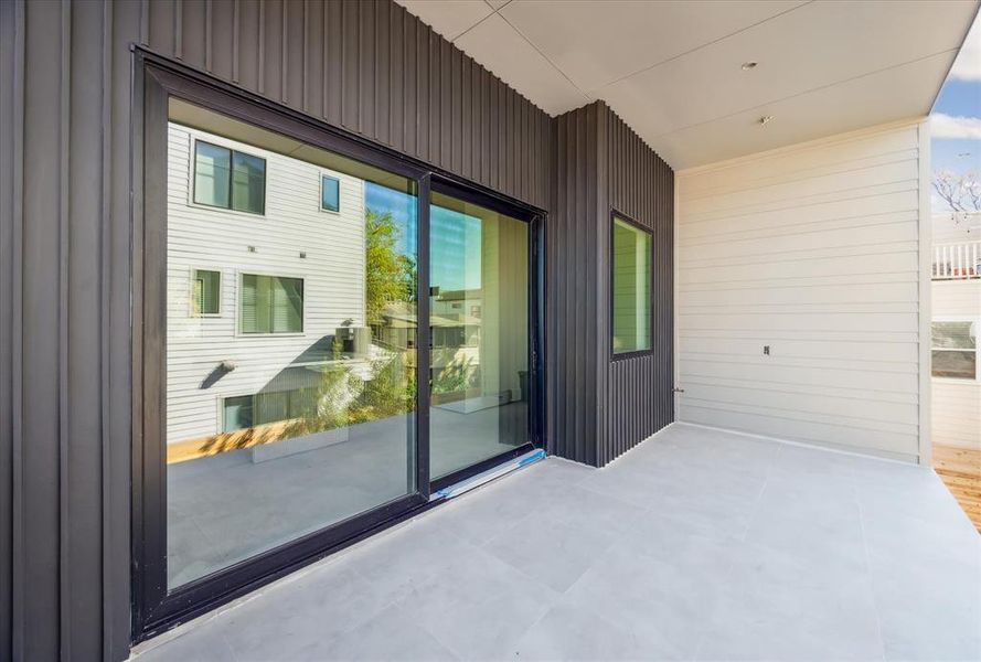 An expansive patio just off the kitchen allows for seamless indoor/outdoor entertainment.