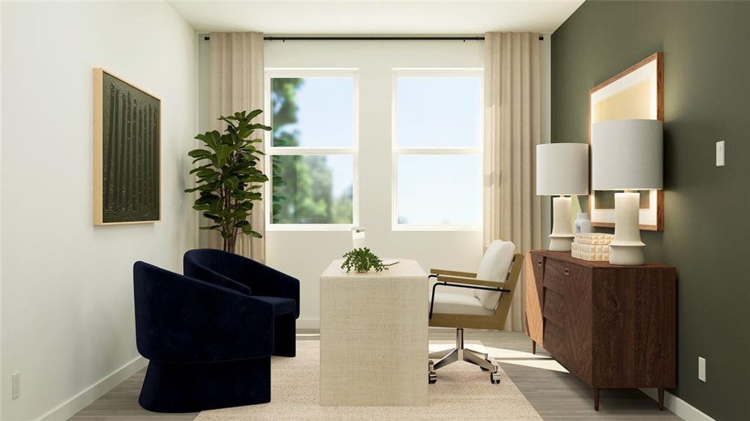 Living area with baseboards and wood finished floors