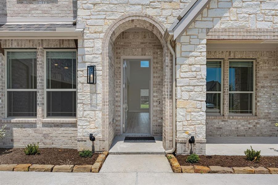 Front exterior of a new home in Sunrise at Garden Valley 60-79, Waxahachie, TX, highlighting curb appeal (Image 22). Front exterior of a new home in Sunrise at Garden Valley 60-79, Waxahachie, TX, highlighting curb appeal (Image 22).