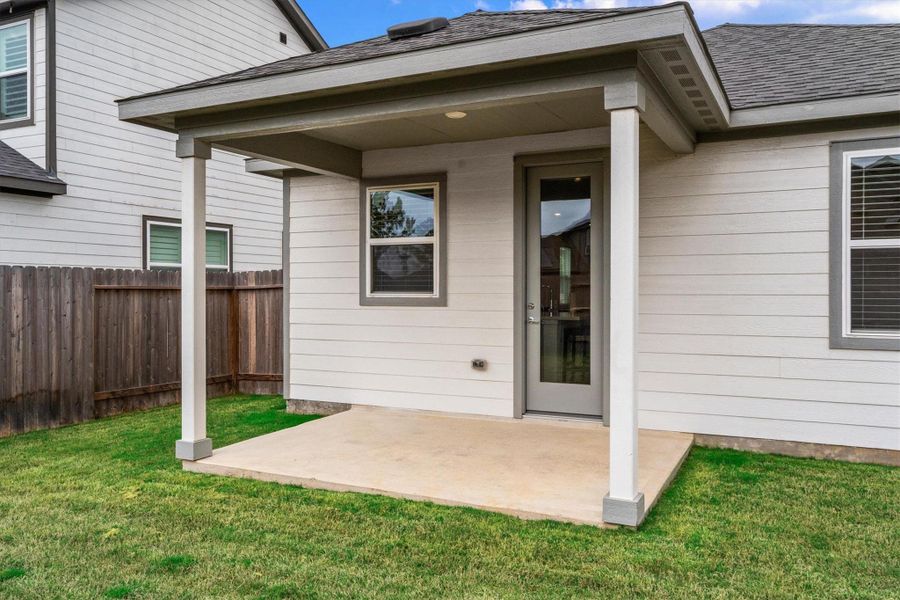Exterior details and patio area of a home in Mason Woods, Cypress (Image 27).
