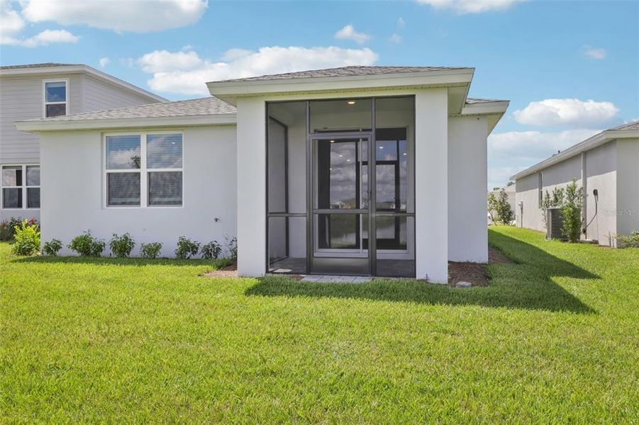 Exterior details and patio area of a home in Crescent Lakes - Premier Series, Punta Gorda (Image 20).