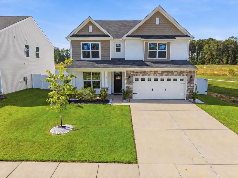 Front exterior of a new home in , Ridgeville, SC, highlighting curb appeal (Image 2). Front exterior of a new home in , Ridgeville, SC, highlighting curb appeal (Image 2).