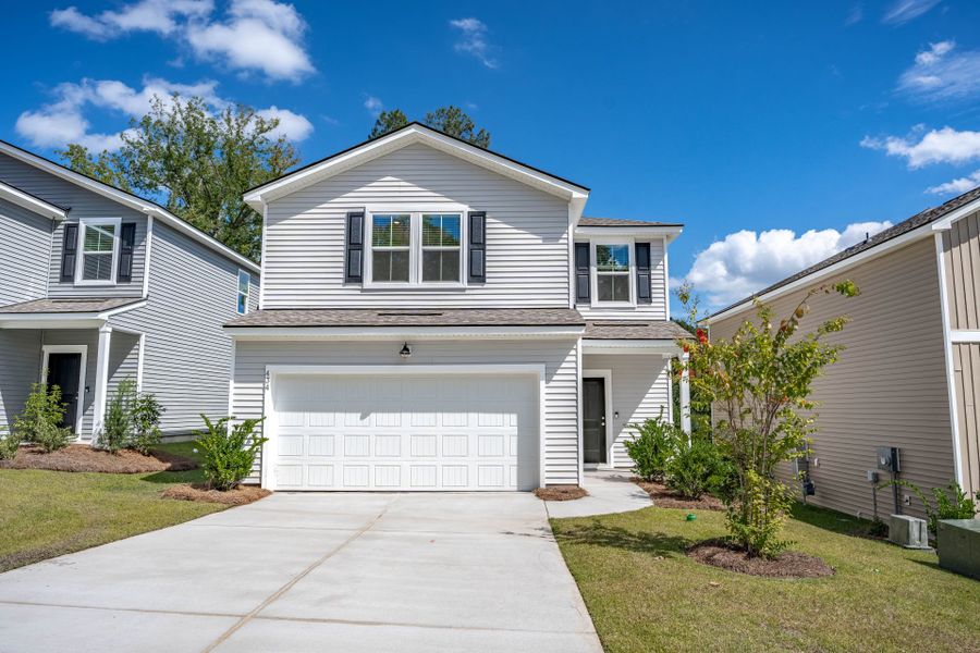 Front exterior of a new home in Grand Arbor, Blythewood, SC, highlighting curb appeal (Image 27).