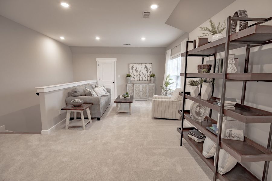 Representative furnished interior of a home built from the Willow by Grant & Co in Manor at Hall Creek, Arlington (Image 58).