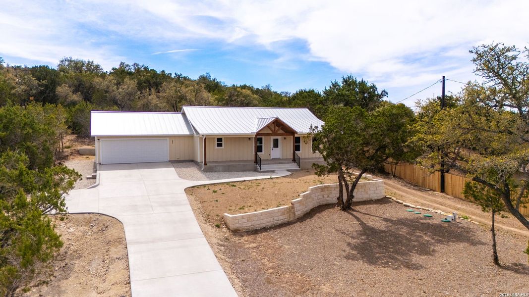 Front exterior of a new home in , Fischer, TX, highlighting curb appeal (Image 26).