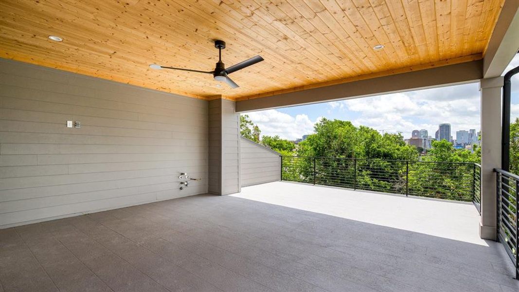 View of terrace featuring a balcony and ceiling fan