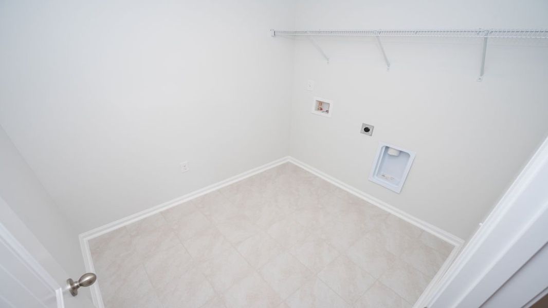 Representative unfurnished interior of a home built from the ROBIE by D.R. Horton in Indigo Preserve, Leland (Image 31).