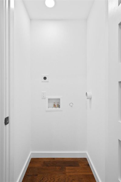 Laundry area featuring electric dryer hookup, washer hookup, dark wood finished floors, and baseboards