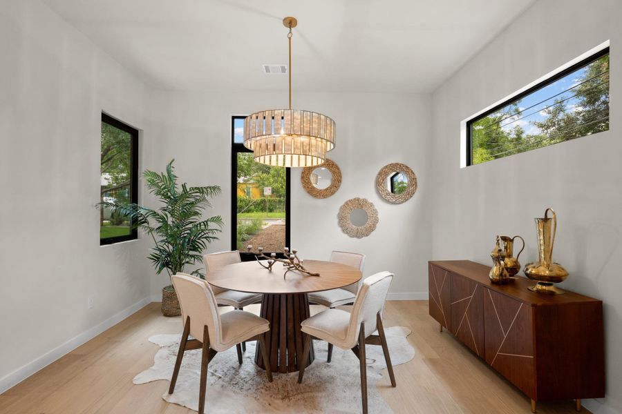 Natural light illuminates a refined dining area, perfect for intimate gatherings. Natural light illuminates a refined dining area, perfect for intimate gatherings.