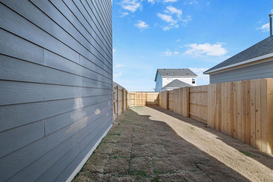 View of fenced backyard