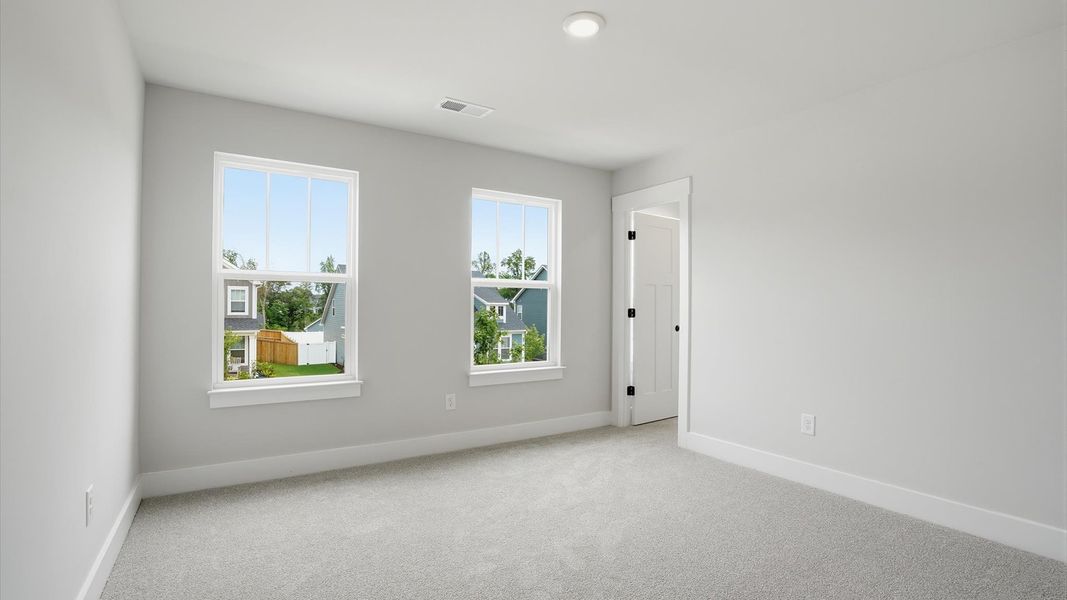 Functional secondary bedrooms with carpeted flooring and modern touches in an exceptional layout near Lake Hartwell