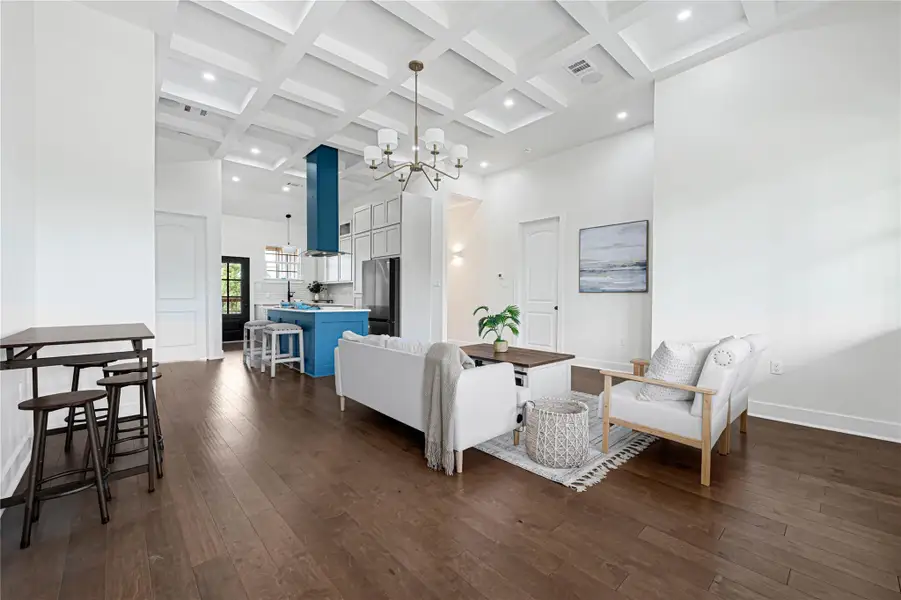 This home features a sleek open-concept design, seamlessly connecting the living, dining, and kitchen areas for effortless entertaining and modern living.