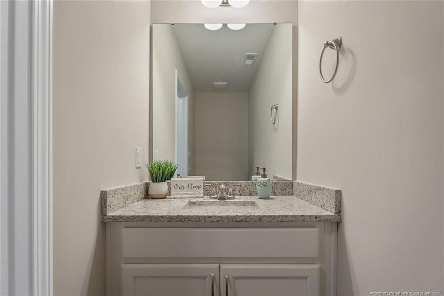 Vanity with granite countertop
