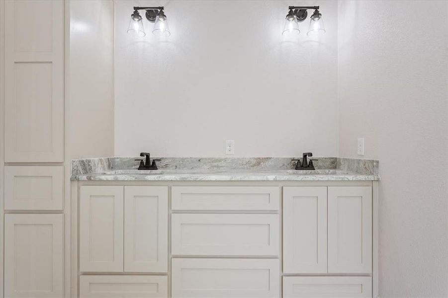 Full bath featuring double vanity