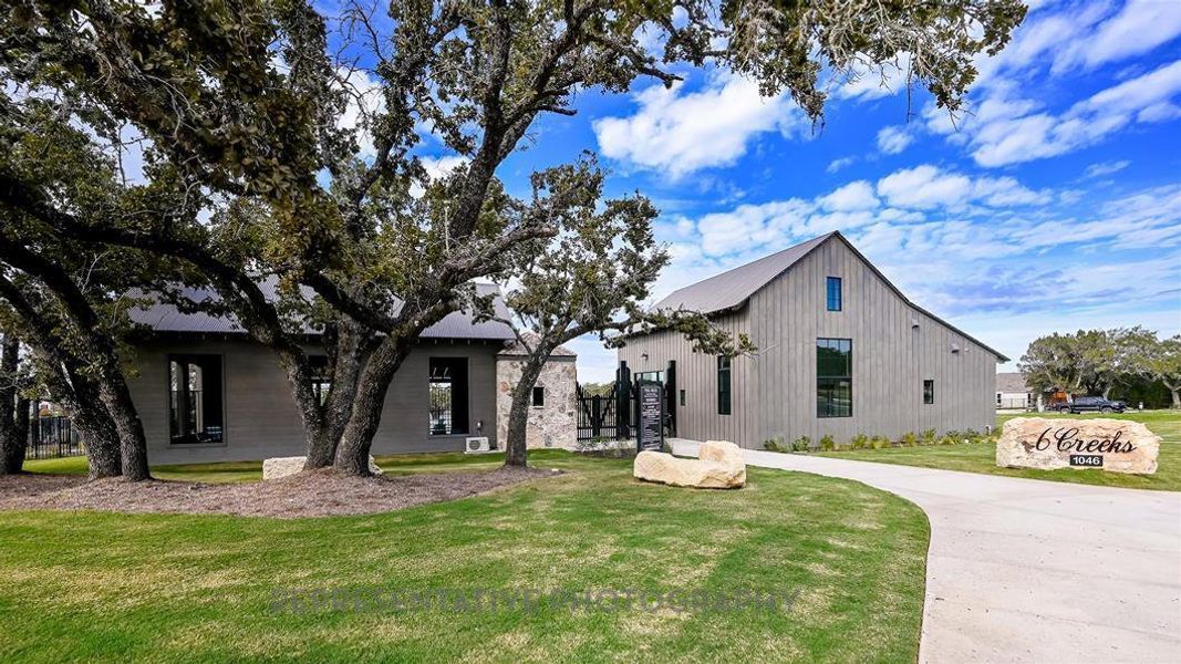 Front exterior of a new home in 6 Creeks at Waterridge, Kyle, TX, highlighting curb appeal (Image 29).