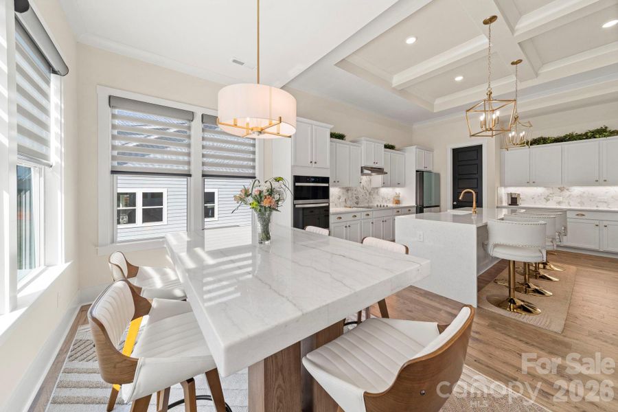 Breakfast/Dining Area with Custom Window Treatments and Brushed Gold Pendant Lights
