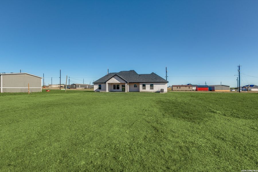 Exterior details and patio area of a home in , Atascosa (Image 23).