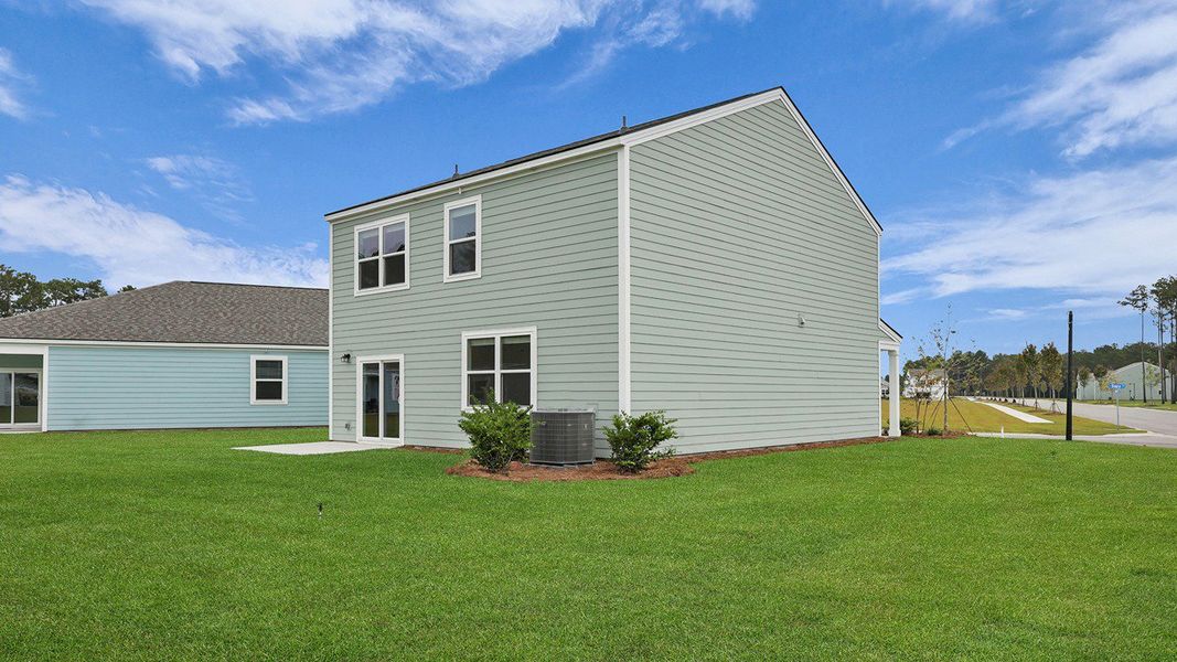 Front exterior of a new home in Hillcrest, Ravenel, SC, highlighting curb appeal (Image 19). Front exterior of a new home in Hillcrest, Ravenel, SC, highlighting curb appeal (Image 19).