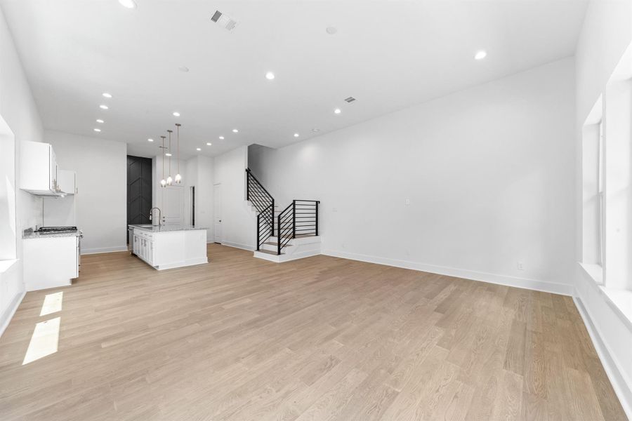 The open layout effortlessly blends the kitchen and living space, enhancing flow and making the home feel bright and connected.