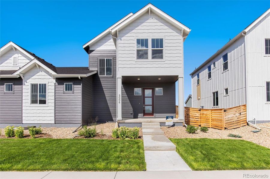 Front exterior of a new home in Trailside on Harmony, Timnath, CO, highlighting curb appeal (Image 23).