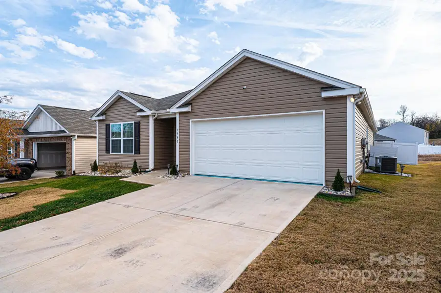 Front exterior of a new home in Villages of Maiden, Maiden, NC, highlighting curb appeal (Image 1). Front exterior of a new home in Villages of Maiden, Maiden, NC, highlighting curb appeal (Image 1).