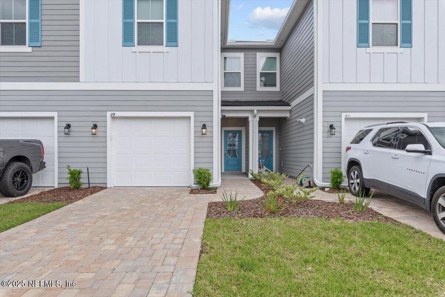 Front exterior of a new home in Brandon Lakes at Silver Landing, St. Augustine, FL, highlighting curb appeal (Image 2). Front exterior of a new home in Brandon Lakes at Silver Landing, St. Augustine, FL, highlighting curb appeal (Image 2).