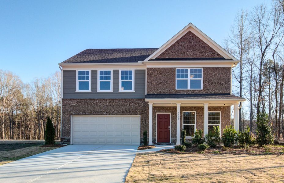 Representative exterior photo of a completed home built from the Hampton by Pulte Homes in Hawthorne Ridge, McDonough, GA (Image 1).