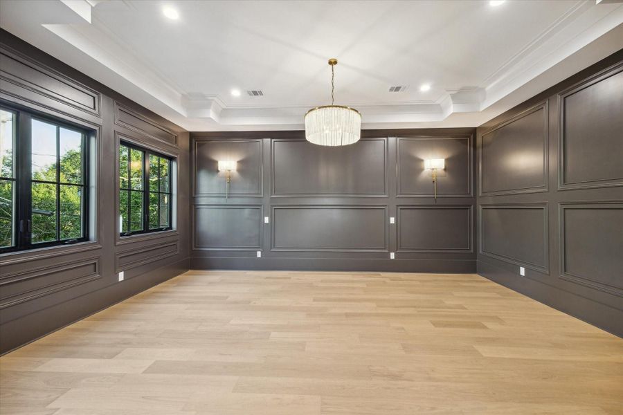 Primary suite features exquisite wall trim, high end chandelier, wall sconces and accent paint color, not to mention level 5 paint quality*Picture is of a recently constructed home by the builder.  1519 Candlelight will be similar in quality, but these pictures are not meant to be an exact representation of the new home. Specs of home may change at sole discretion of the seller.