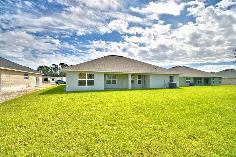 Exterior details and patio area of a home in Cadence Crossing, Auburndale (Image 27).